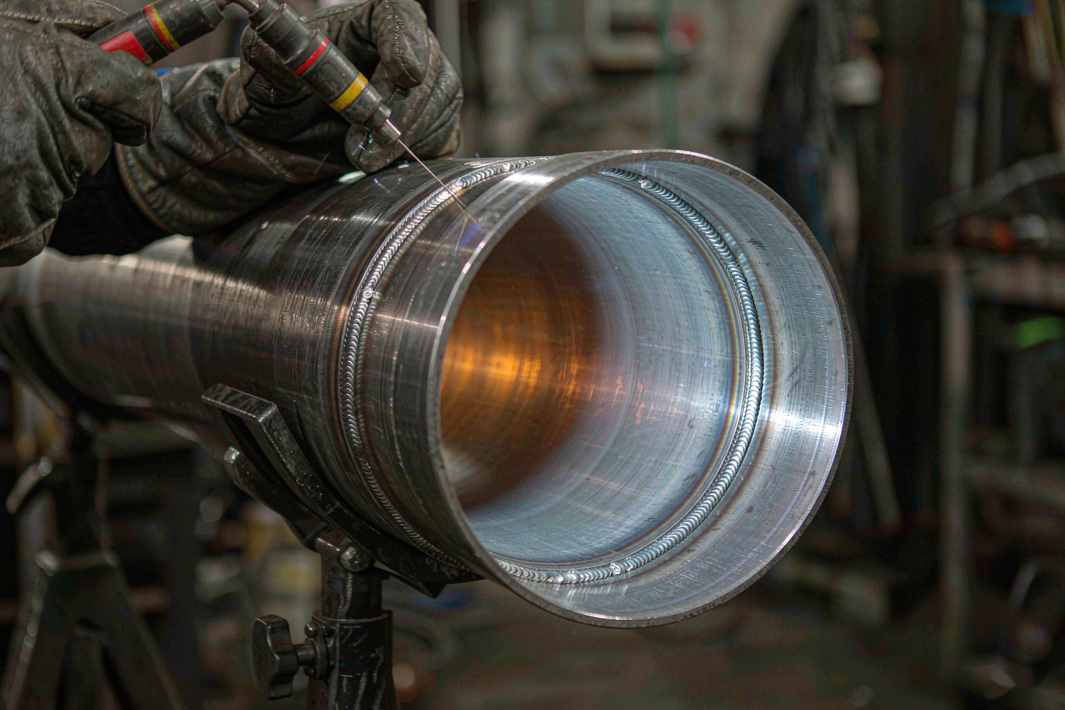 GTAW root pass welding on a butt-jointed alloy steel pipe with argon shielding