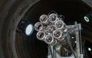 Magnetic flux leakage in-line inspection pig with sensor rings entering a large diameter coated steel pipeline