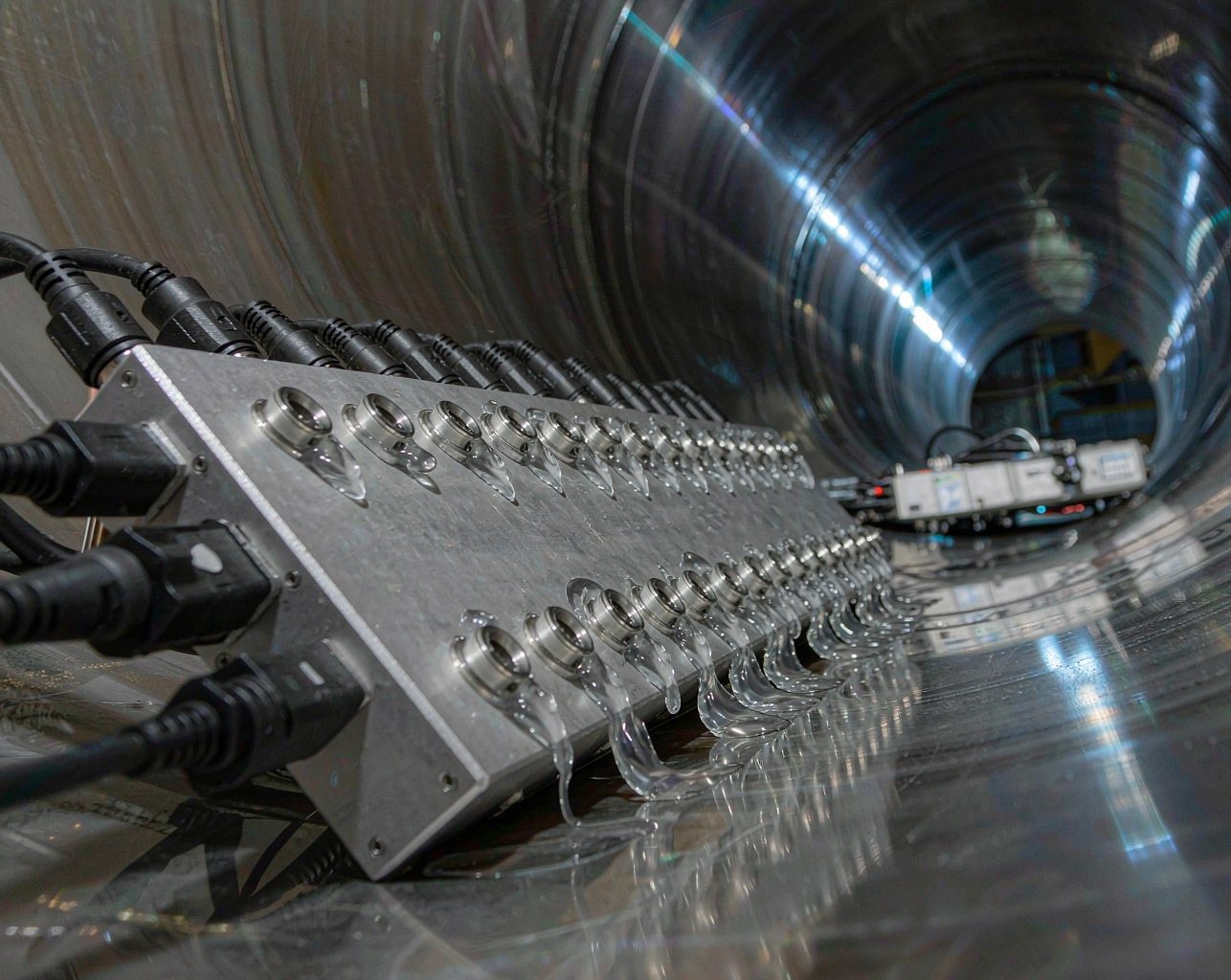 Ultrasonic wall thickness probe array scanning the internal surface of a large steel line pipe